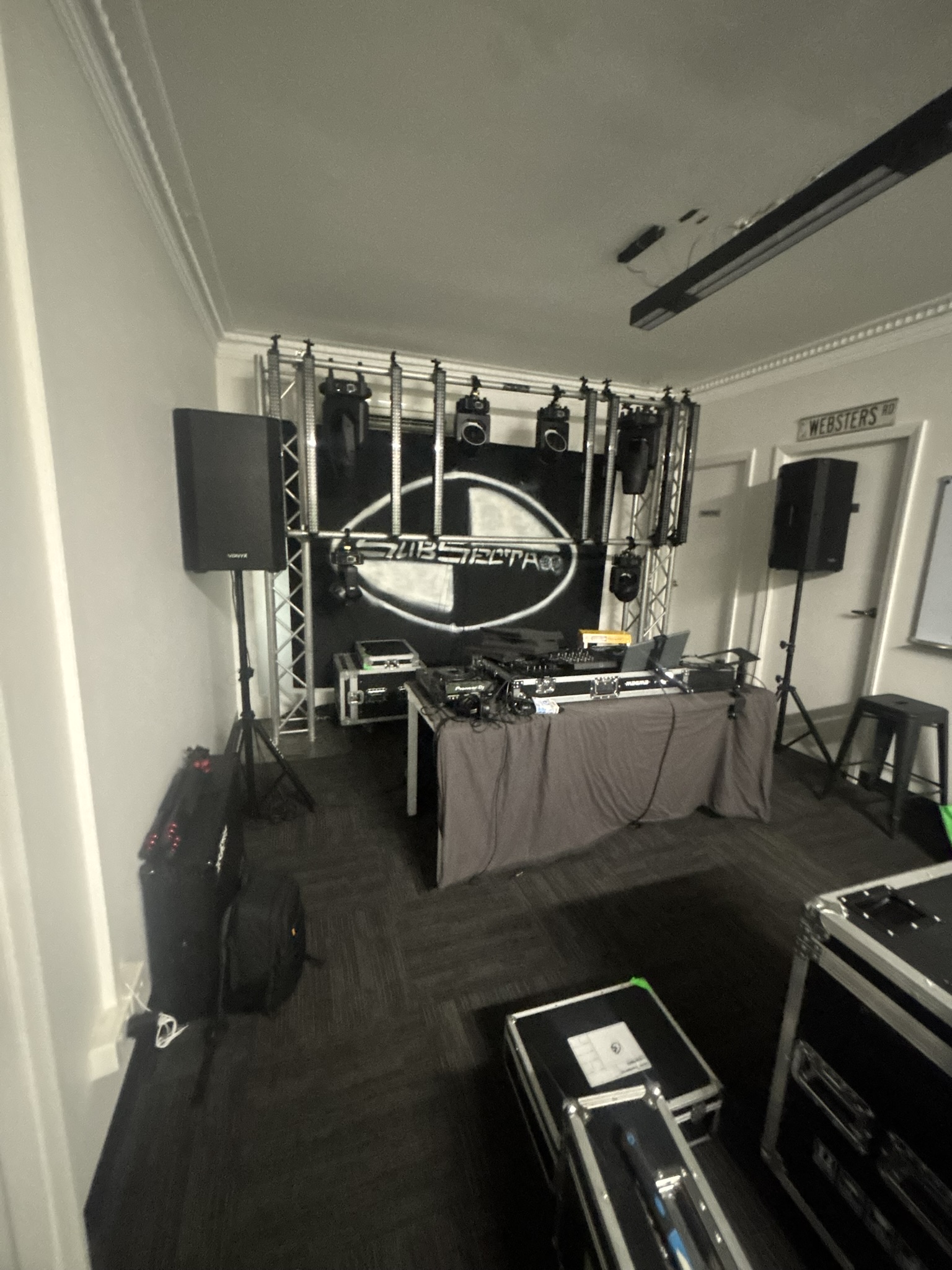 The SubSecta rig and branded backdrop, DJ table and moving heads set up and ready for the night